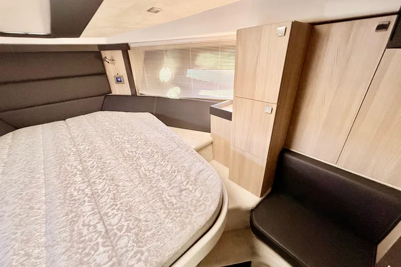 Slide: The Image of Luxurious interior of 2016 Cranchi M44 HT yacht with wood finishes and modern amenities. - 103