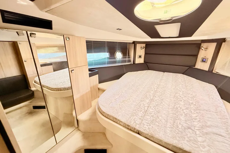Slide: The Image of Modern bathroom in 2016 Cranchi M44 HT yacht, featuring sleek fixtures and a porthole window. - 106