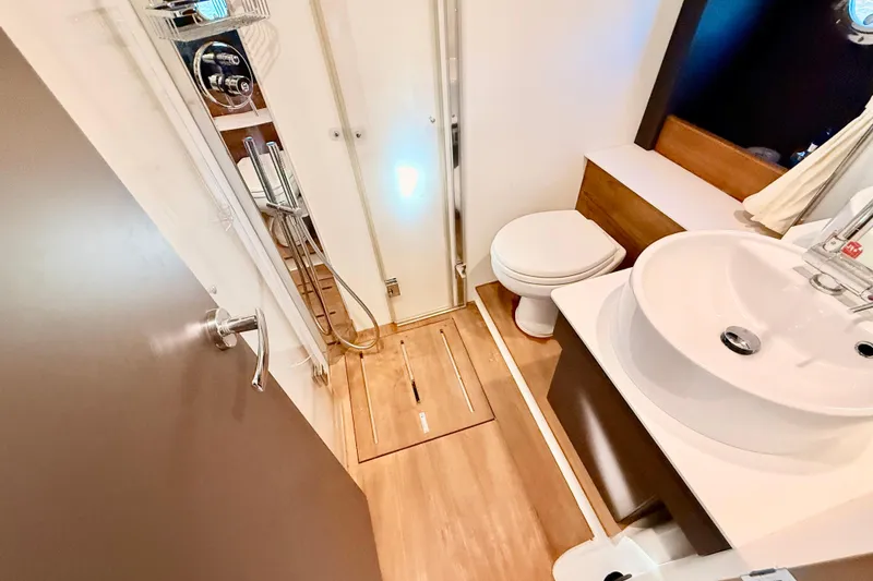 Slide: The Image of Interior of 2016 Cranchi M44 HT yacht bathroom with modern fixtures and wood accents. - 112