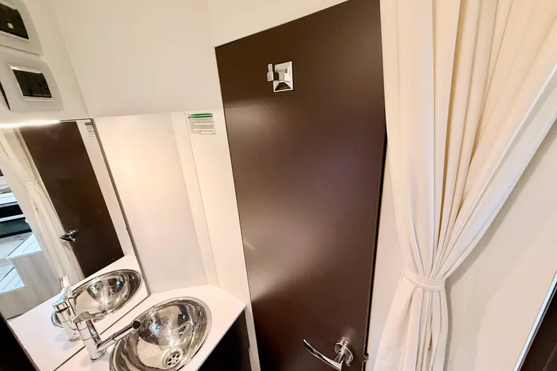 Slide: The Image of Modern bathroom interior of 2016 Cranchi M44 HT yacht with sleek sink and mirror. - 117