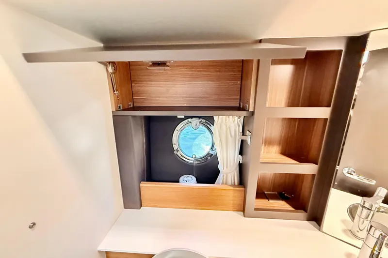 Slide: The Image of Interior of 2016 Cranchi M44 HT yacht with elegant bedding and wooden cabinetry. - 120