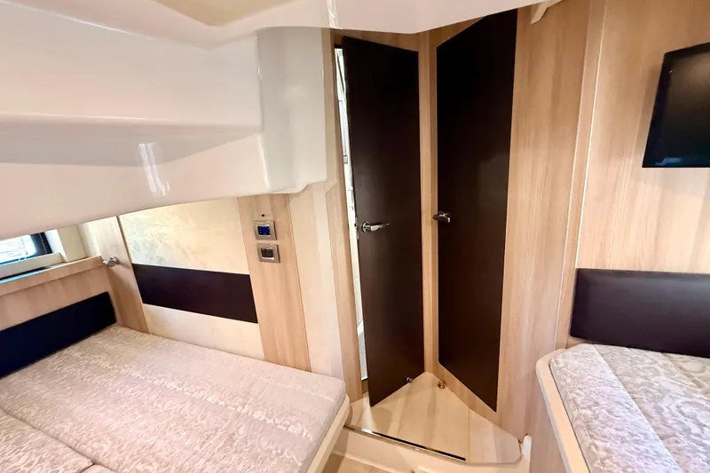 Slide: The Image of Interior view of 2016 Cranchi M44 HT yacht, featuring wooden finishes and modern design. - 128