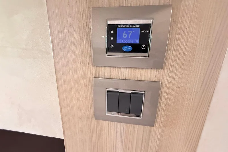 Slide: The Image of Interior of 2016 Cranchi M44 HT yacht with wooden cabinetry and hidden trash bin. - 129