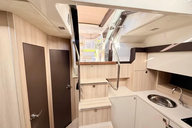 Slide: The Image of Interior detail of 2016 Cranchi M44 HT yacht with cup holders and window view. - 136