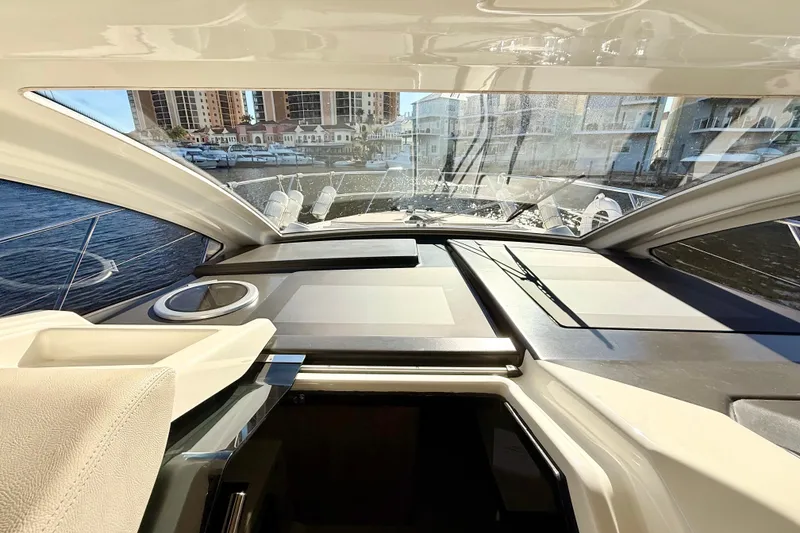 Slide: The Image of 2016 Cranchi M44 HT boat steps with wood finish near water. - 138