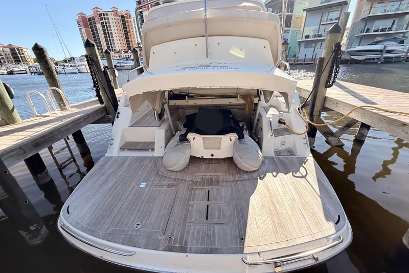 Slide: The Image of 2016 Cranchi M44 HT yacht docked by waterfront homes. - 144
