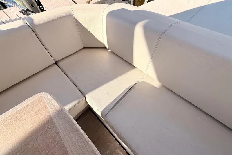 Slide: The Image of 2016 Cranchi M44 HT yacht docked, featuring sunbathing area and luxurious design. - 164