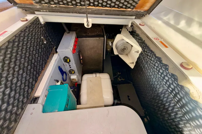 Slide: The Image of 2016 Cranchi M44 HT yacht interior with beige seating and wooden table. - 17