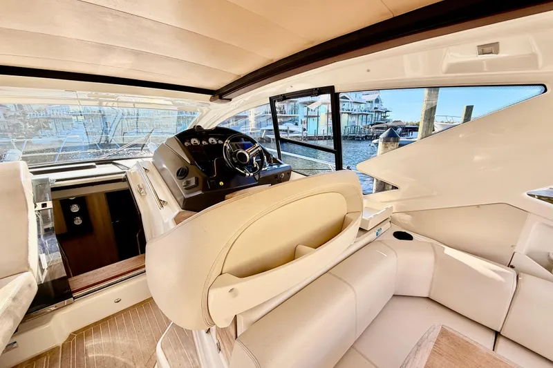 Slide: The Image of Interior of 2016 Cranchi M44 HT yacht with helm and plush seating. - 27