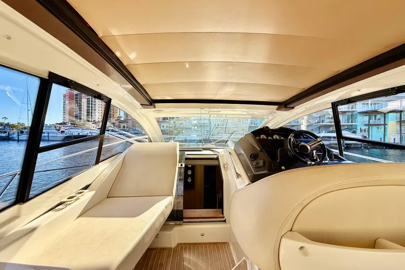 Slide: The Image of 2016 Cranchi M44 HT yacht helm with modern controls and waterfront view. - 29