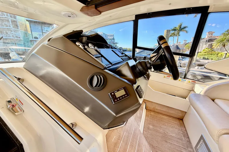 Slide: The Image of Helm of 2016 Cranchi M44 HT yacht with modern navigation controls and displays. - 31