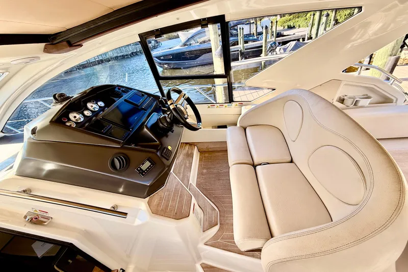Slide: The Image of Cockpit of 2016 Cranchi M44 HT yacht with navigation controls and displays. - 33