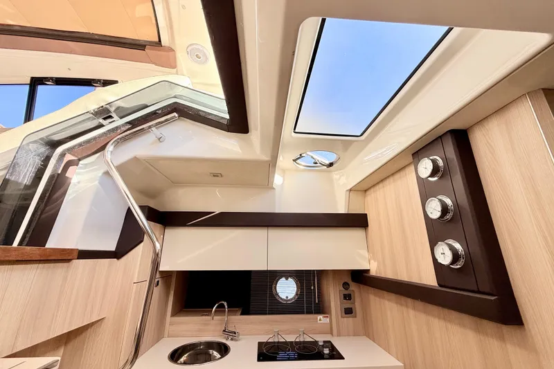 Slide: The Image of Modern kitchen in 2016 Cranchi M44 HT yacht with stove, sink, and Miele oven. - 50