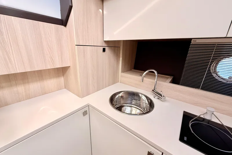 Slide: The Image of Modern kitchen in 2016 Cranchi M44 HT yacht with Miele oven and glass storage. - 58