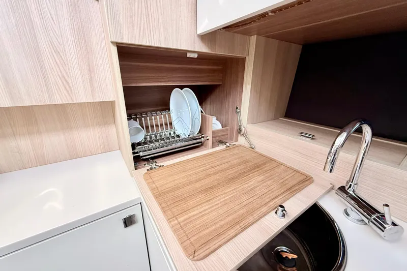 Slide: The Image of Modern kitchen cabinet with glassware storage on a 2016 Cranchi M44 HT yacht. - 59