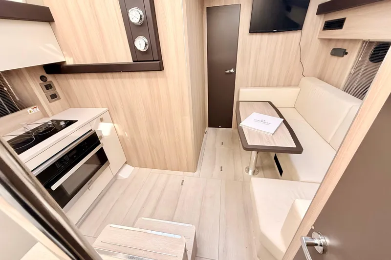 Slide: The Image of Interior of 2016 Cranchi M44 HT yacht with modern seating and skylight. - 80