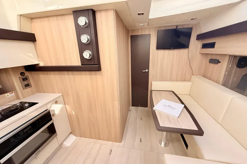 Slide: The Image of Interior of 2016 Cranchi M44 HT yacht with beige seating and table. - 81