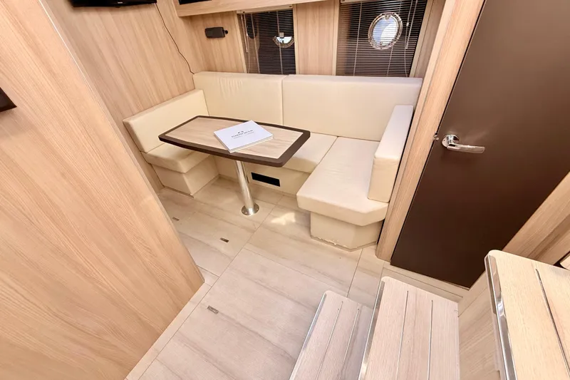 Slide: The Image of Interior of 2016 Cranchi M44 HT yacht with modern seating and wooden finishes. - 83