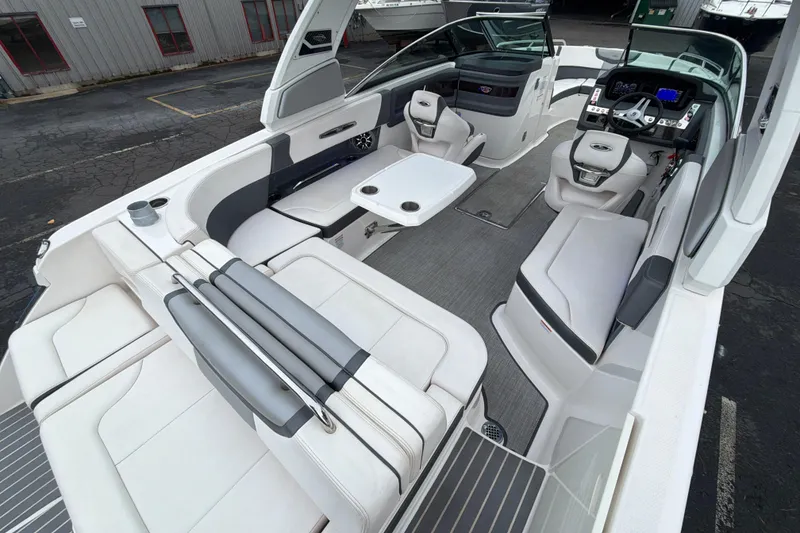 Slide: The Image of 2018 Chaparral 267 SSX boat interior with luxurious seating and modern dashboard. - 14