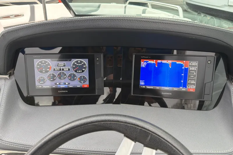 Slide: The Image of Dashboard of 2018 Chaparral 267 SSX with Garmin navigation displays. - 18