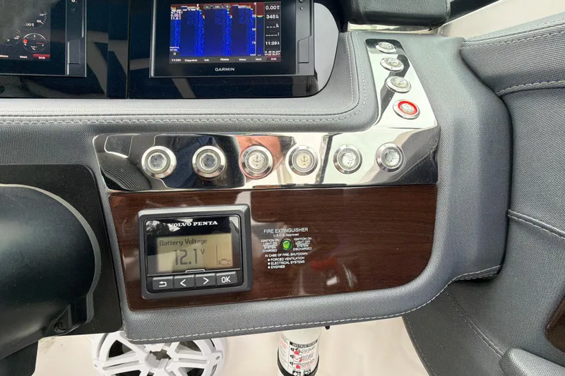 Slide: The Image of Dashboard of 2018 Chaparral 267 SSX boat with control panel and digital display. - 20