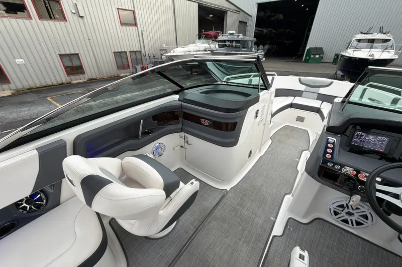 Slide: The Image of Interior of 2018 Chaparral 267 SSX boat with modern seating and dashboard. - 22
