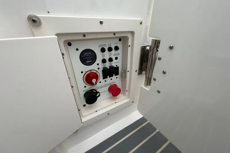 Slide: The Image of Control panel of 2018 Chaparral 267 SSX boat, featuring switches and dials. - 33