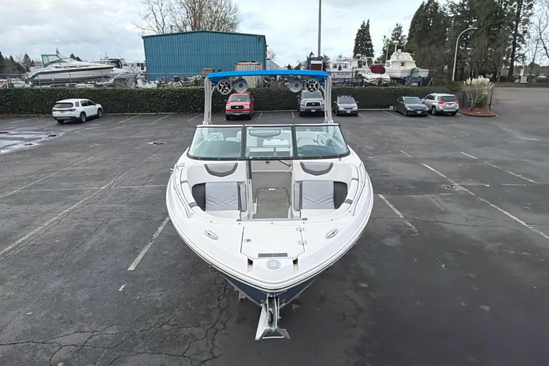 Slide: The Image of 2018 Chaparral 267 SSX boat in parking lot, front view, overcast sky. - 8