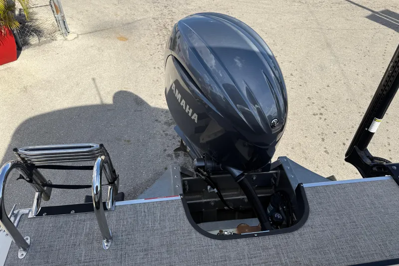 Slide: The Image of 2024 Premier Sunspree boat with Yamaha outboard motor and boarding ladder. - 10
