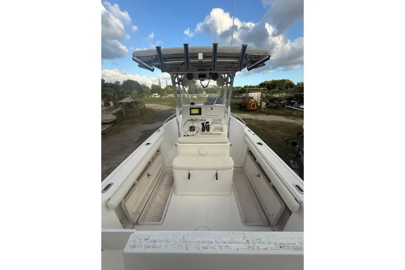 Slide: The Image of 2005 Pro-Line 24 Sport boat on trailer, showing propeller and ladder. - 10