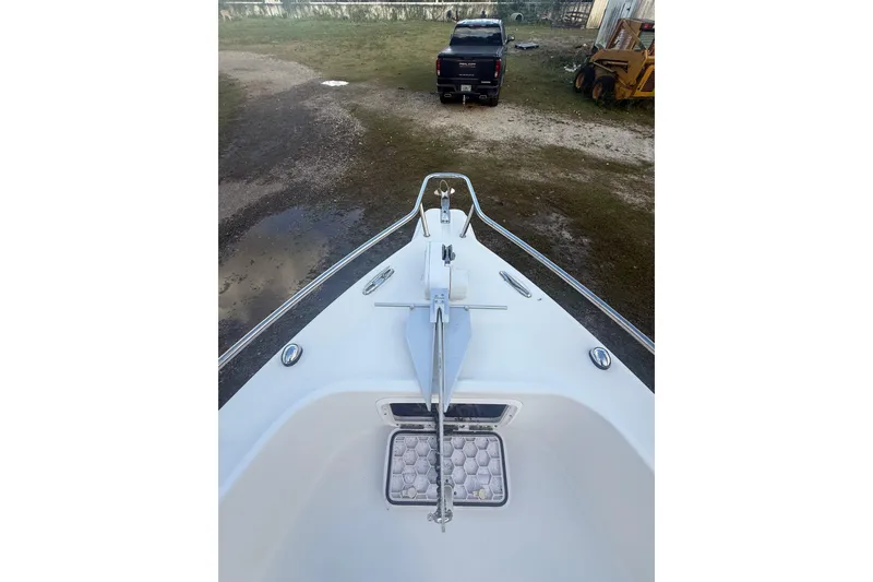 Slide: The Image of 2005 Pro-Line 24 Sport boat cockpit with Garmin navigation and steering wheel. - 19