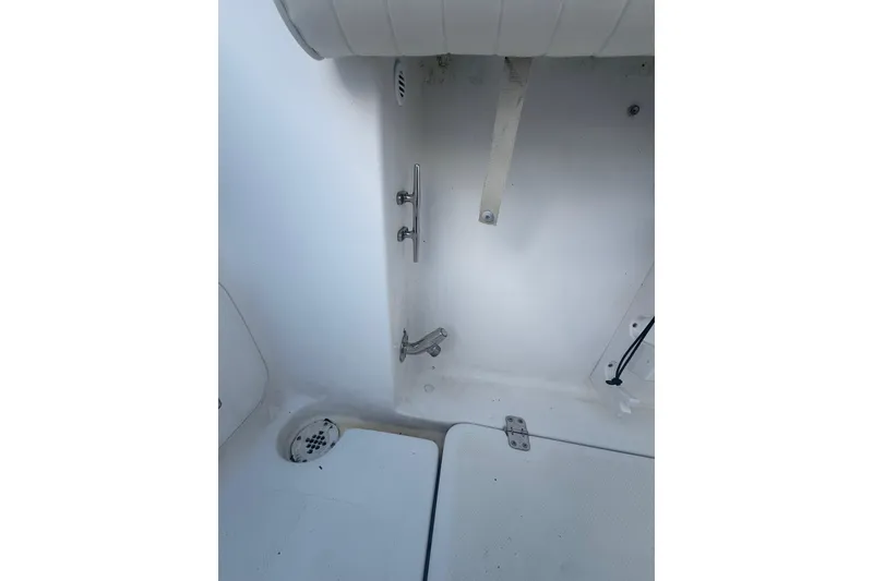 Slide: The Image of 2005 Pro-Line 24 Sport boat console with Garmin navigation and steering wheel. - 22