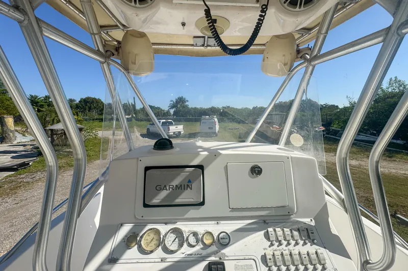 Slide: The Image of 2005 Pro-Line 24 Sport boat dashboard with Garmin navigation system. - 24