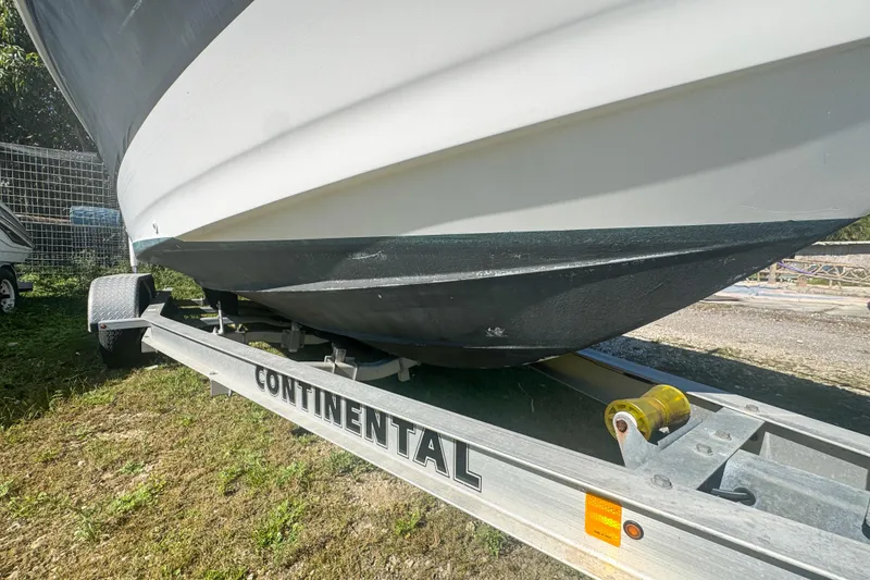 Slide: The Image of 2005 Pro-Line 24 Sport boat on Continental trailer, side view. - 44