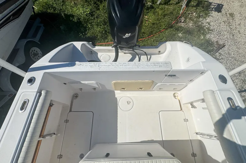 Slide: The Image of 2005 Pro-Line 24 Sport boat interior with engine, viewed from above. - 55