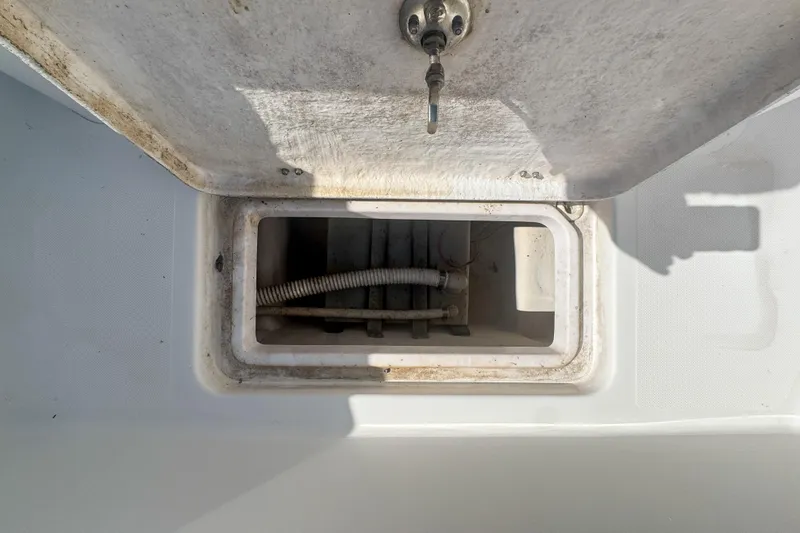 Slide: The Image of Open storage compartment on a 2005 Pro-Line 24 Sport boat. - 61