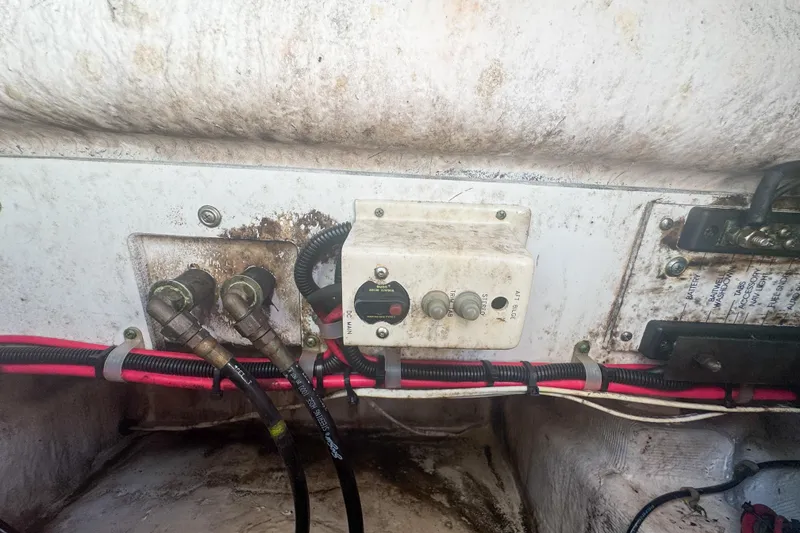 Slide: The Image of Electrical panel and wiring inside a 2005 Pro-Line 24 Sport boat. - 66