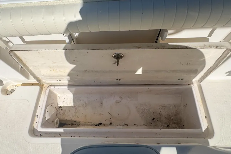 Slide: The Image of Open storage compartment on a 2005 Pro-Line 24 Sport boat. - 82