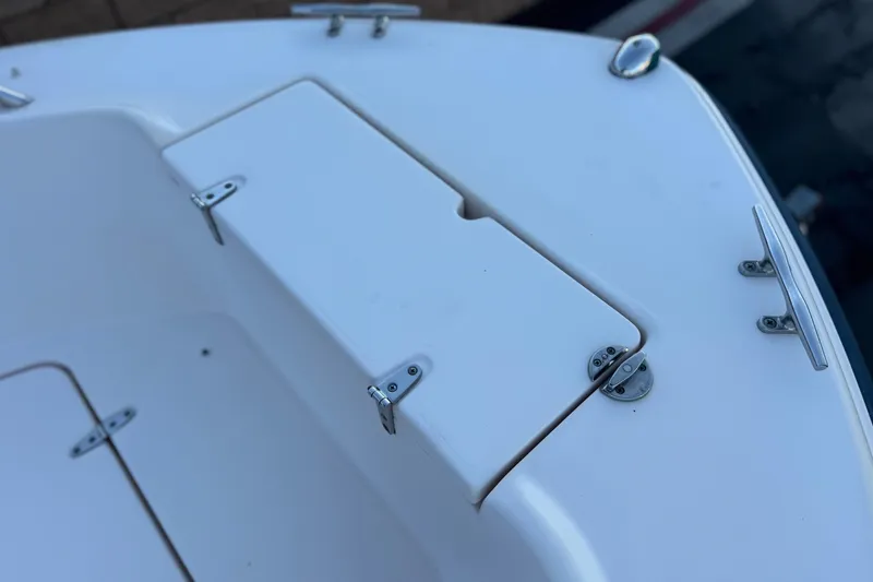 Slide: The Image of 2008 Grady-White Sportsman 180 boat deck with storage compartment and cleats. - 11