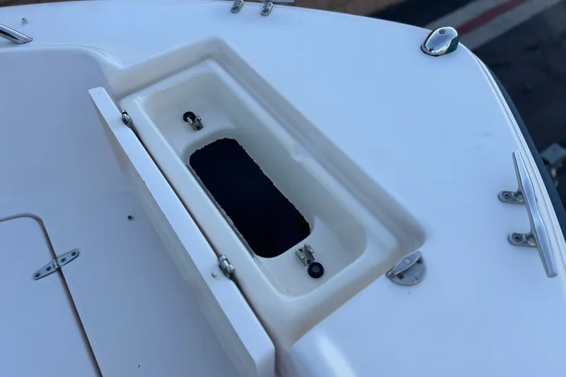 Slide: The Image of 2008 Grady-White Sportsman 180 boat deck with open storage compartment. - 12