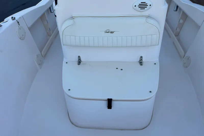 Slide: The Image of 2008 Grady-White Sportsman 180 boat interior with white seating and storage compartment. - 14