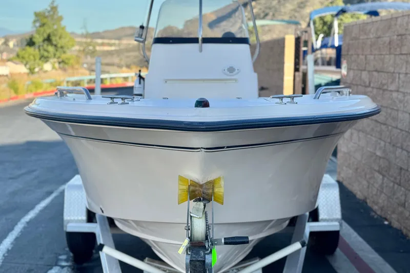 Slide: The Image of 2008 Grady-White Sportsman 180 boat on trailer, parked outdoors. - 2