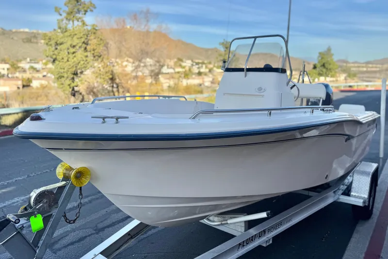 Slide: The Image of 2008 Grady-White Sportsman 180 boat on trailer, scenic background. - 3