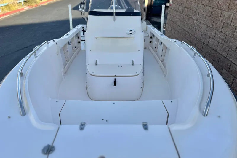 Slide: The Image of 2008 Grady-White Sportsman 180 boat interior with white seating and stainless steel rails. - 8