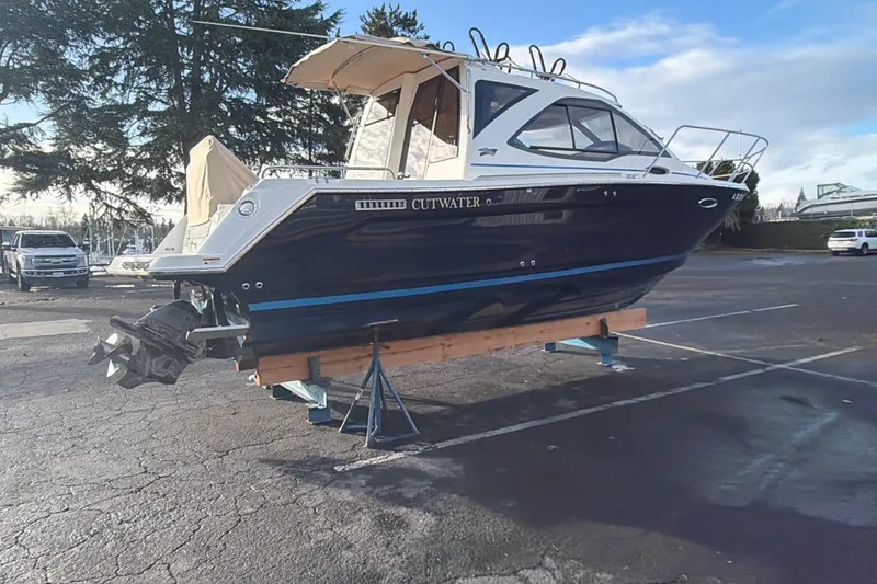 Slide: The Image of 2016 Cutwater C-242 Coupe boat on a trailer in a parking lot. - 19