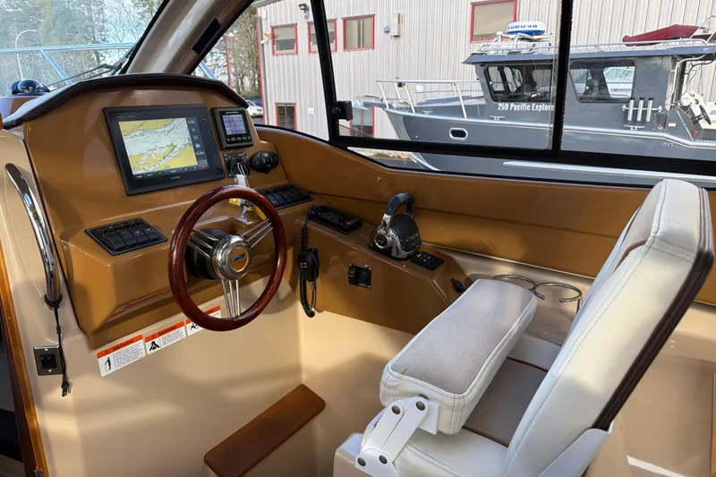 Slide: The Image of Helm of 2016 Cutwater C-242 Coupe with navigation display and steering wheel. - 28