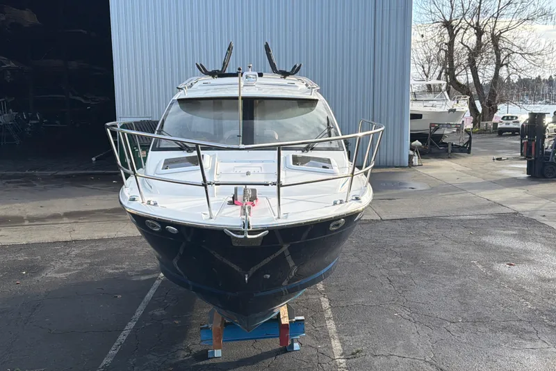Slide: The Image of 2016 Cutwater C-242 Coupe boat in a marina setting, front view. - 3