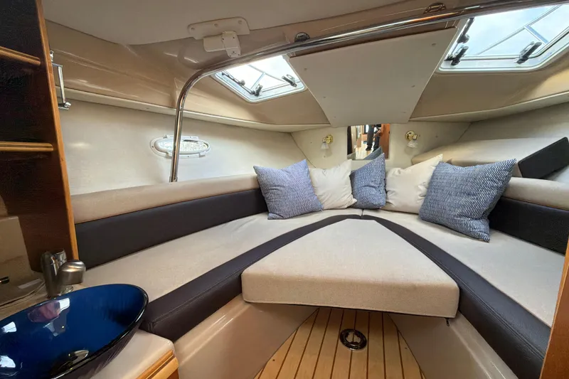 Slide: The Image of Interior of 2016 Cutwater C-242 Coupe boat with cozy seating and cushions. - 37