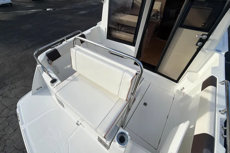 Slide: The Image of 2016 Cutwater C-242 Coupe boat interior with seating and open cabin door. - 43