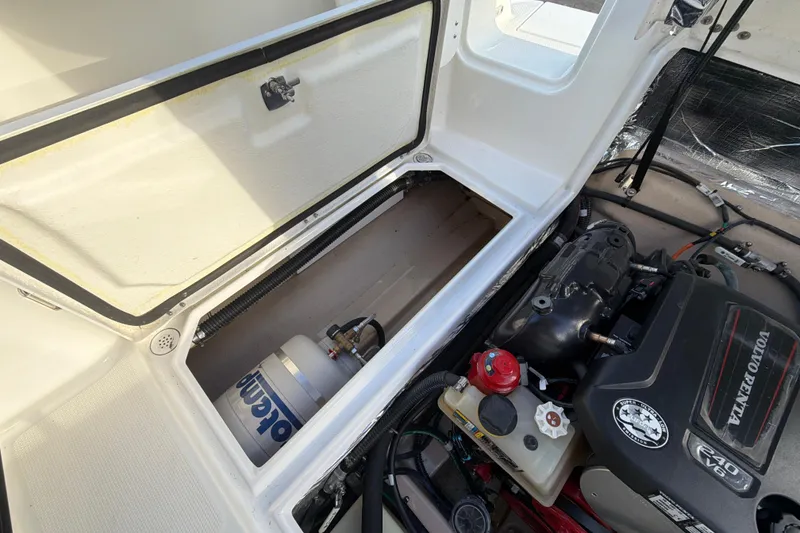 Slide: The Image of 2016 Cutwater C-242 Coupe engine compartment with Volvo Penta V6 engine and storage area. - 45
